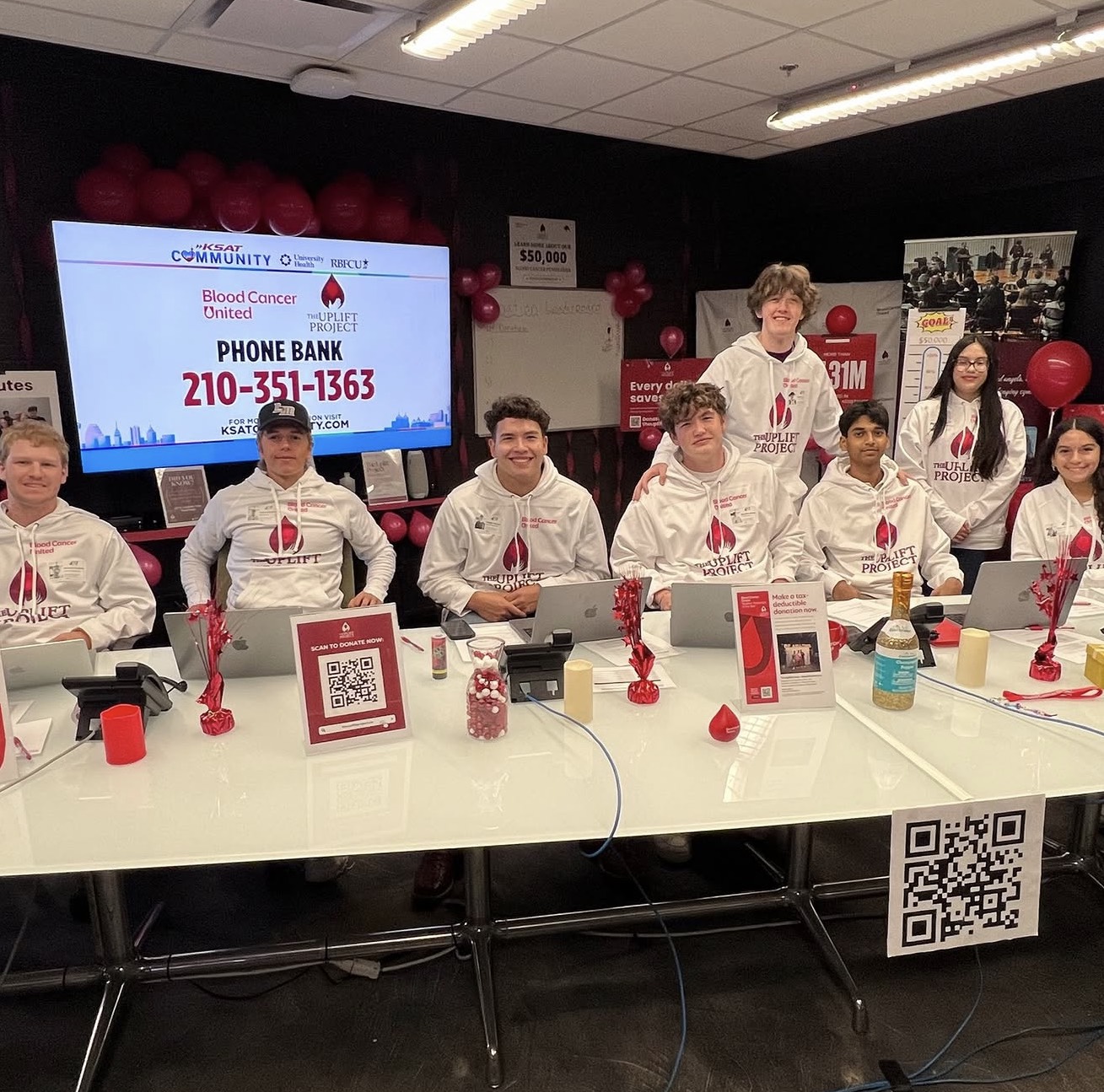 The Uplift Project team at KSAT headquarters for the phone bank Rehan Raj organized